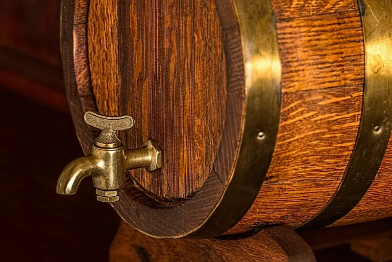A brass tap on an oak cask