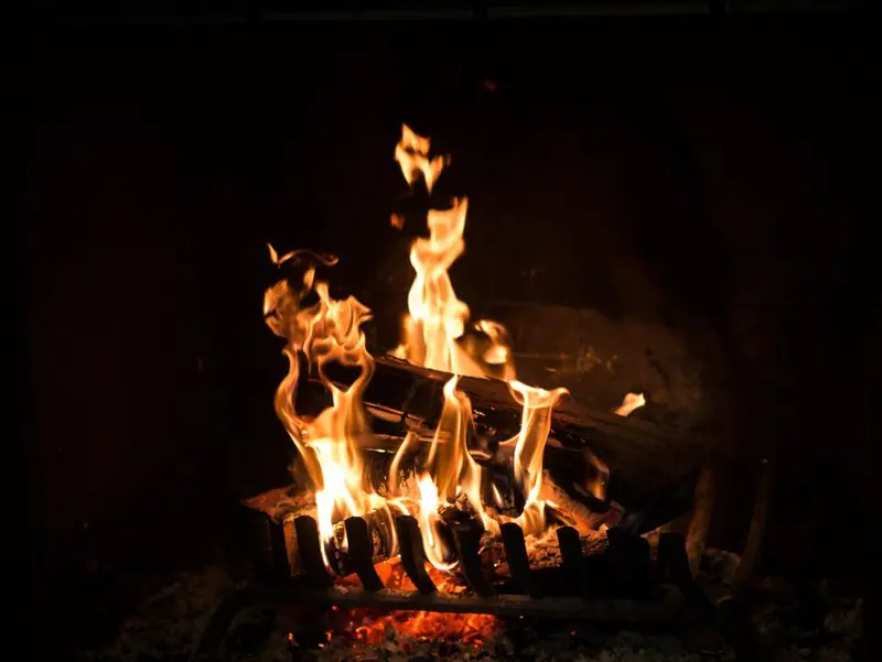 Logs burning in an open fireplace